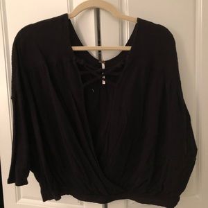 Free people black flowy top deep v size XS.